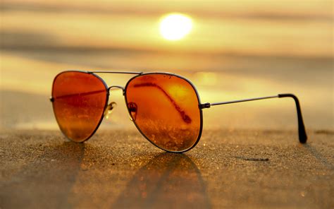 Download Sun Sand Beach Man Made Sunglasses 4k Ultra Hd Wallpaper