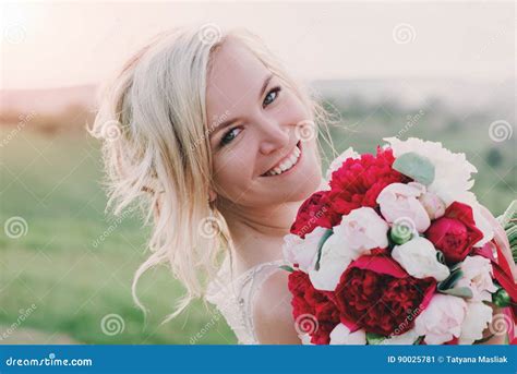 Beautiful Happy Blonde Woman In White Dress Smiling In Sun Light Glow