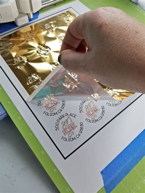 A Person Is Making Gold Foil On A Piece Of Paper