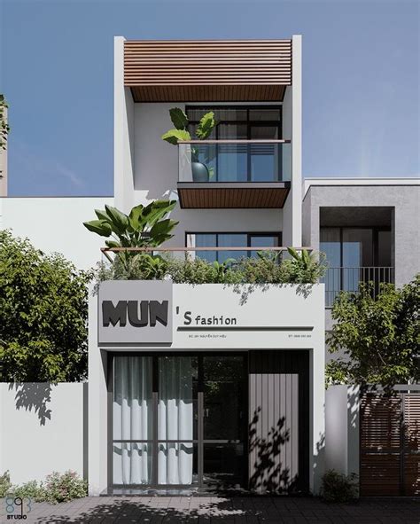 An Apartment Building With Plants Growing On The Balconies