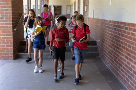 School Pupils Walking In Corridor Stock Photos Creative Market