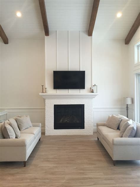 White Living Room With Shiplap Ceiling Woods Beams And Vertical Strip