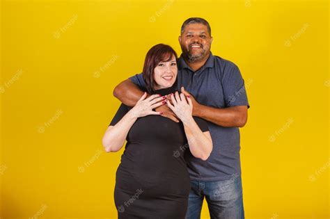 Premium Photo Brazilian Couple Caucasian Woman And Black Man Hugging