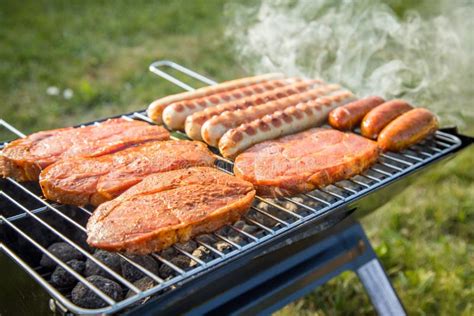 German Bratwurst Sausages And Marinated Pork Neck Steak Meat Roasting