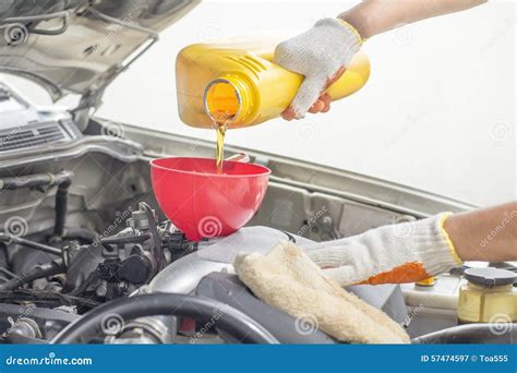 Car Mechanic Pouring New Oil To Engine Stock Image Image Of