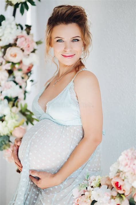 Sensuality Pregnant In Lingerie Dress Embrasing Stomach And Smiling