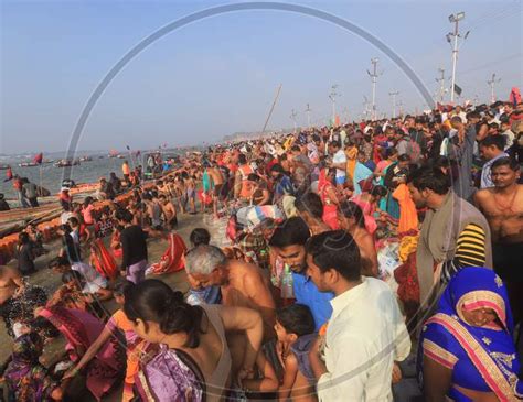 Image Of Crowd Of Indian Devotees Taking Holy Bath In Triveni Sangam