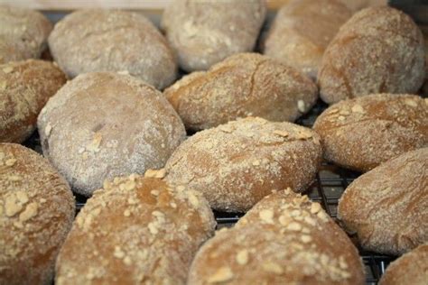 Several Loaves Of Bread Sitting On A Cooling Rack