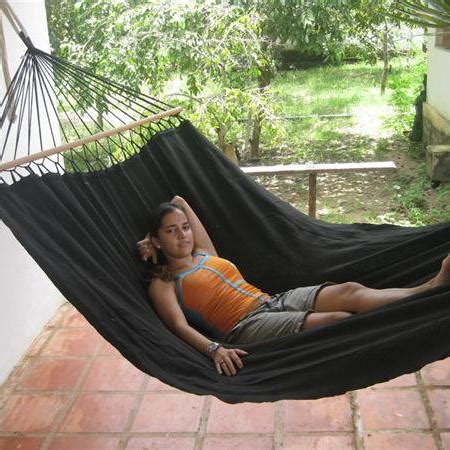 Outstanding weatherproof black hammock with wooden bars