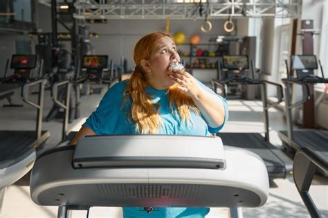 Premium Photo Front View On Funny Obese Woman Eating Cake While