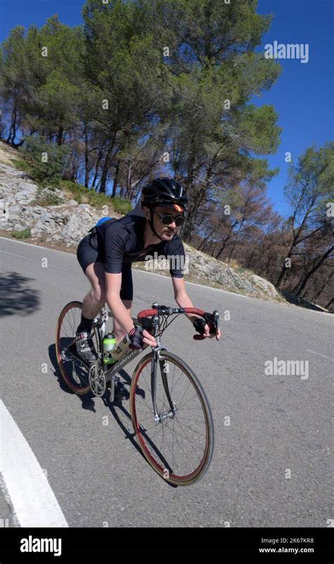 Male Road Cyclist Descending The D In Provence France Stock Photo