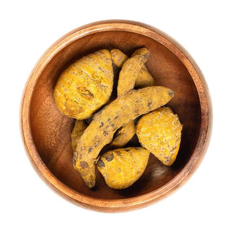 Dried Whole Turmeric Root Dehydrated Rhizomes In A Wooden Bowl Stock