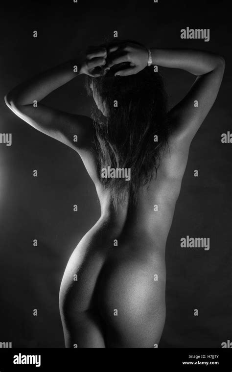 Rear View Of Sexy Nude Black Woman Over Black Background In Black And White Stock Photo Alamy