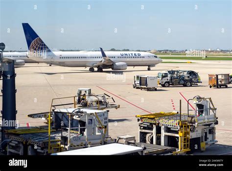 A United Airlines Airplane Prepares To Take Off From The Tarmac At The