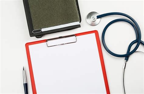 Premium Photo Medical Clipboard With Stethoscope And Pen On White