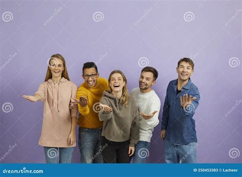 Group Of Happy Young People Saying Come Here Smiling And Doing An