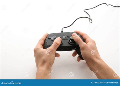 Young Man Holding Video Game Controller On White Closeup Stock Image