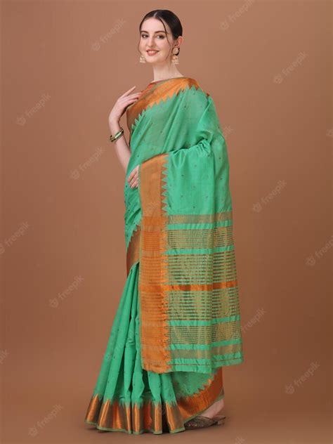 Premium Photo Green And Orange Color Combination Saree With Green And Orange Stripes On The Saree