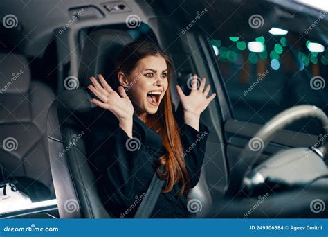 An Emotional Frightened Woman Is Sitting Behind The Wheel Of A Car In A Black Shirt Wearing A