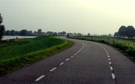 Driving On A Dike Lekdijk In The Dutch Countryside Travel And