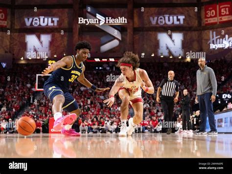 Nebraska S Josiah Allick 53 Passes The Ball Around Michigan S Tarris Reed Jr 32 During The