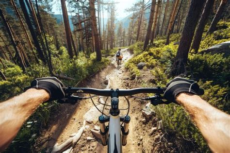 Premium Photo A Person Riding A Bike Down A Dirt Road