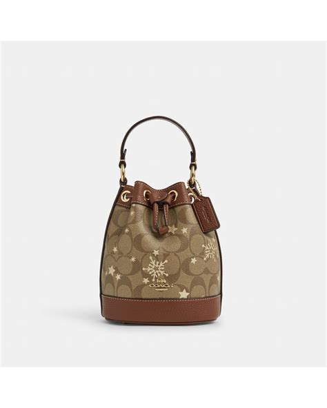 Coach Dempsey Drawstring Bucket Bag In Signature Canvas With Star