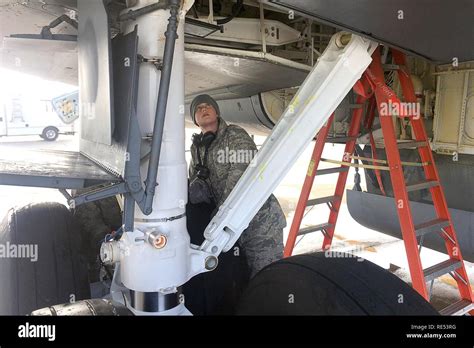 Airman 1st Class Sam Heaton Inspects Components Of The Landing Gear On A Kc 135 Stratotanker At