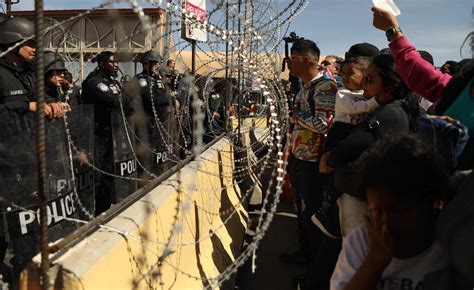 Watch: Large crowd of migrants attempt to storm US-Mexico border ...