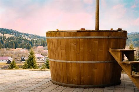 Premium Photo Rustic Hot Tub Against Mountain Landscape In Spring