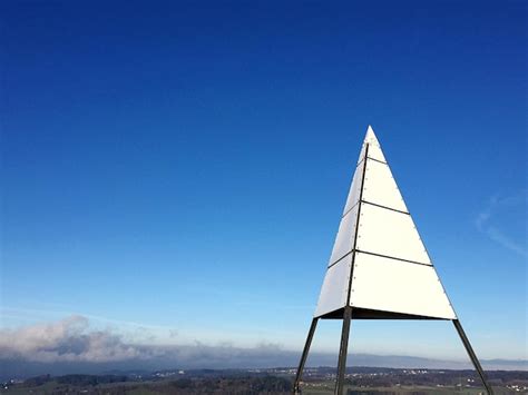 Premium Photo Triangle Shape Tower Against Blue Sky