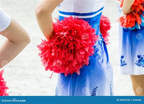 Young Female Cheerleaders Holding Pom Poms Stock Photo Image Of