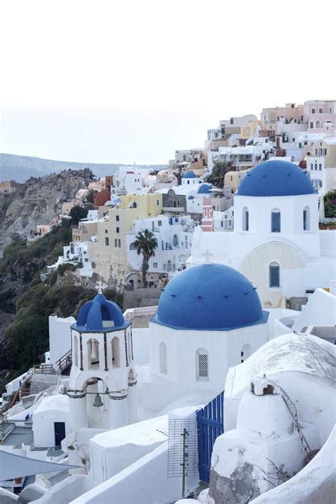 Whitewashed Houses And Blue Dome Church By The Aegean Sea Santoriniin