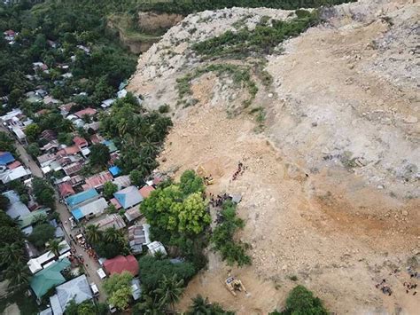 At least 21 dead as landslide engulfs dozens of homes in Naga City ...