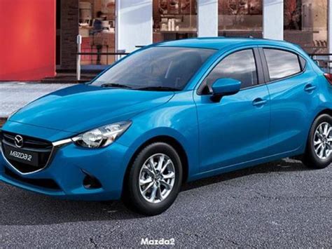 How To Replace A Headlight Bulb On A Mazda2 Car Ownership Autotrader