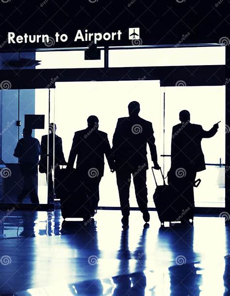 Business Travelers Exiting Airport Terminal Stock Image Image Of