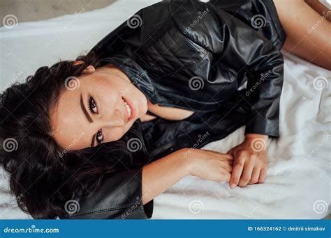 Girl In Black Lingerie Is Lying On A White Bed Stock Photo Image Of