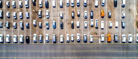 Premium Ai Image An Aerial View Of A Parking Lot Filled With Cars