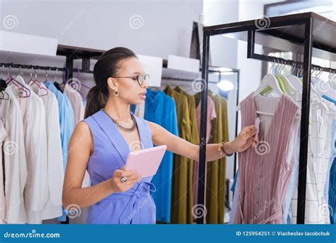 Concentrated Sale Assistant Maintaining Outstanding Clothing Store