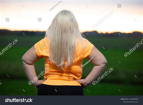Chubby Blonde Woman Stands Her Back Stock Photo 2218944605 Shutterstock