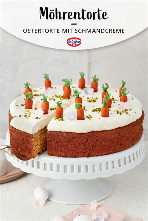 A Cake With White Frosting And Carrots On It