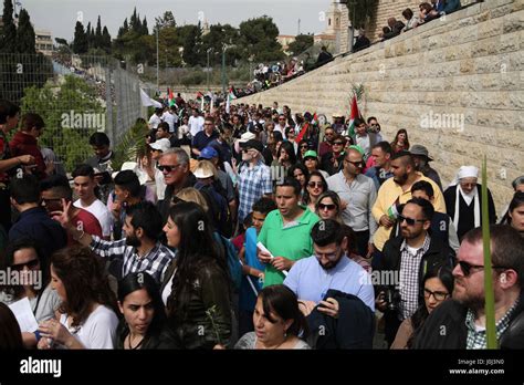 Christian Pilgrims Start Walking Down From Mount Olives In A Palm