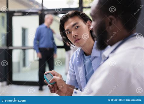 African American Physician Measuring Insulin Level And Glucose In Blood