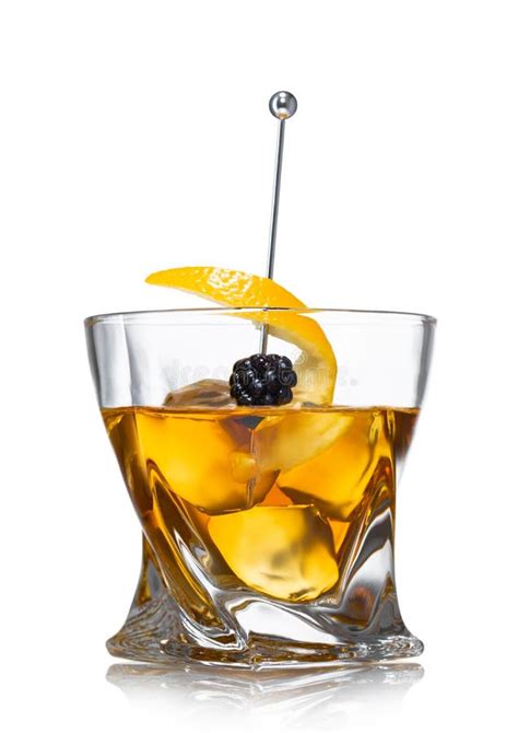 Old Fashioned Cocktail Glass With Ice Cubes And Blackberry On Still