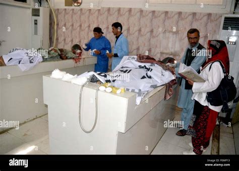 Paramedical Staffs Examining Dead Bodies Of Firing Incident Victims