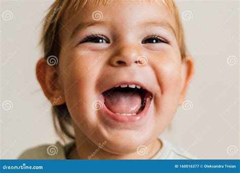 Excited Face Of A Small Baby Toddler On White Background Pure Joy