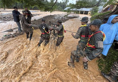 Landslides caused by heavy rains kill at least 93 and bury many others ...