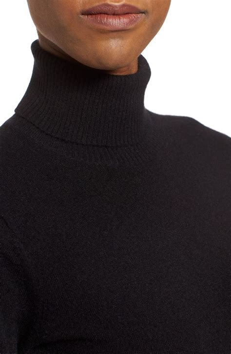 A Woman Wearing A Black Turtle Neck Sweater