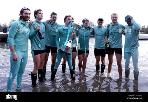 Cambridge Men S Cox Jasper Parish Centre Celebrates With The Trophy