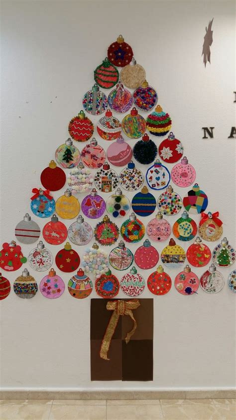 A Christmas Tree Made Out Of Buttons On The Wall